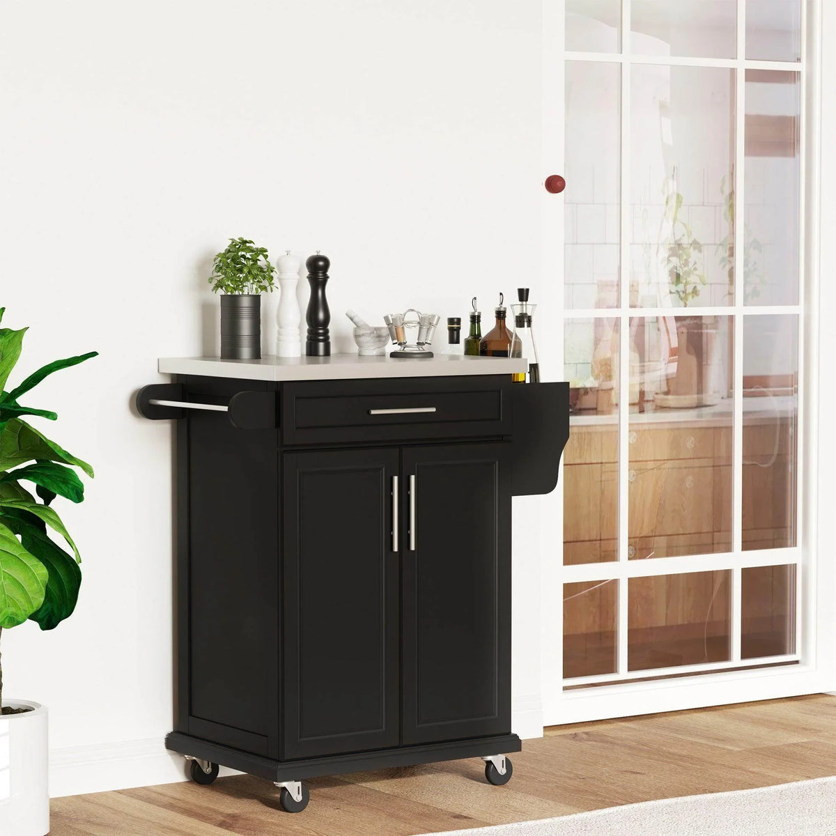 Black kitchen island cart with stainless steel top, drawer front, and double-door cabinet on casters.