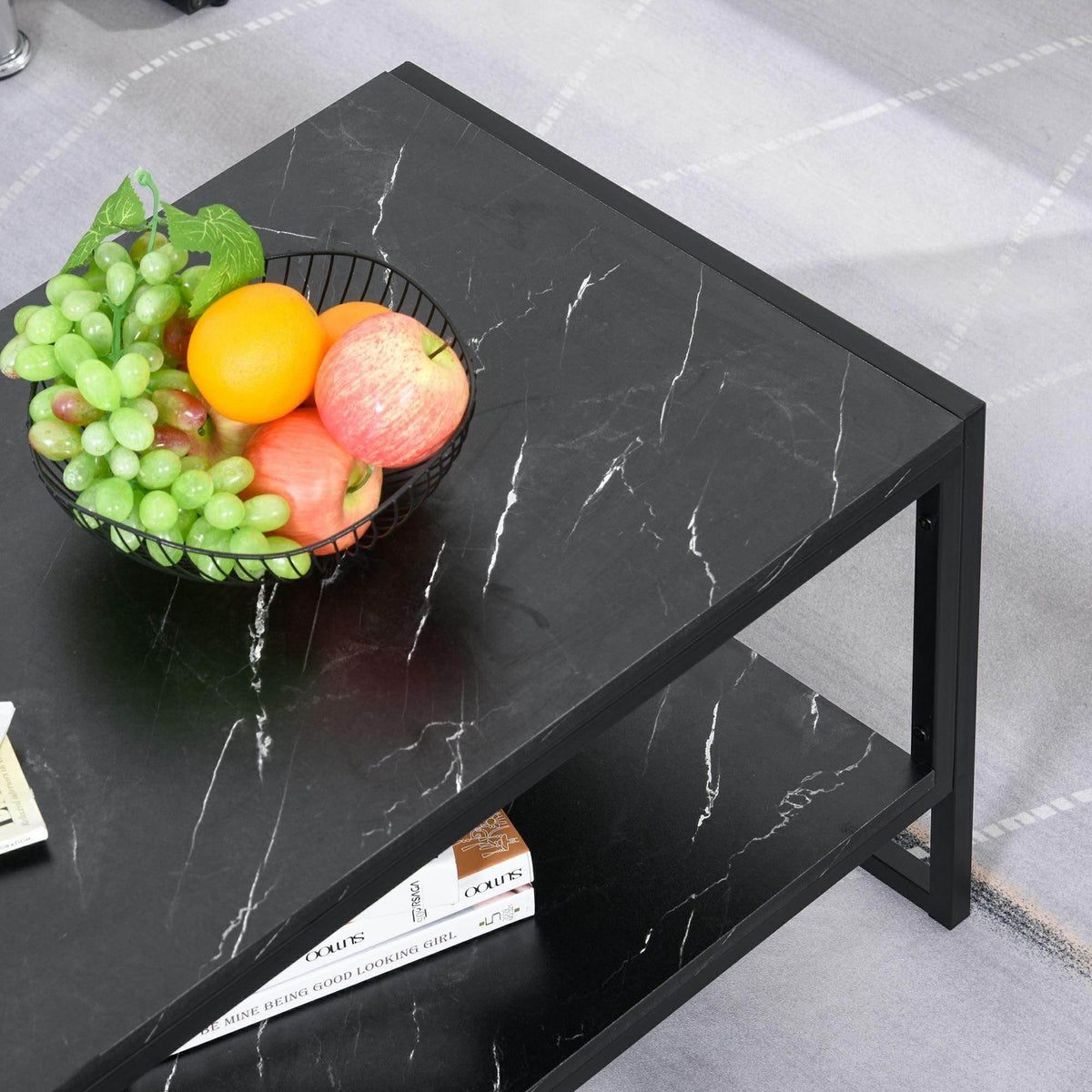 Black marble-print 2-tier coffee table with fruit bowl on top and open shelf below