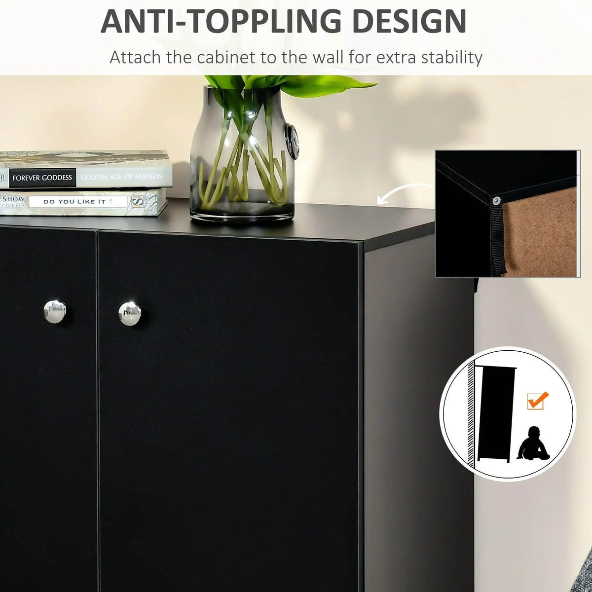 Black storage cabinet with double doors and round knobs, wall-anchoring strap visible
