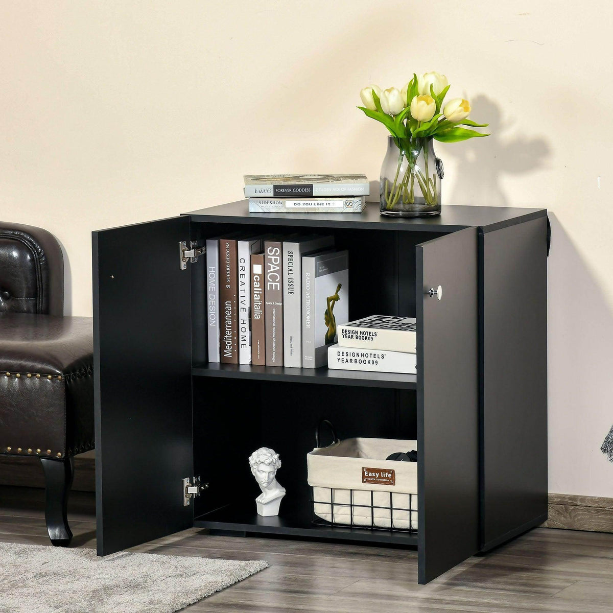 Black storage cabinet open with two shelves and round knobs, showing interior storage