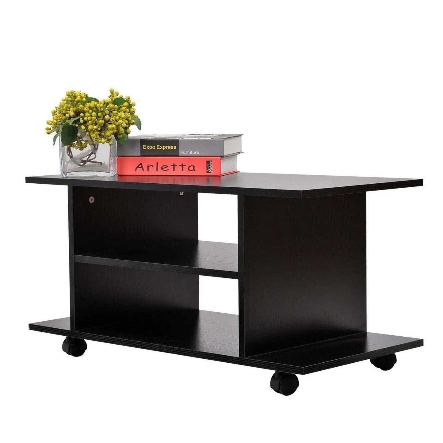 Black modern TV stand with shelves and caster wheels holding a vase with yellow berries and two books