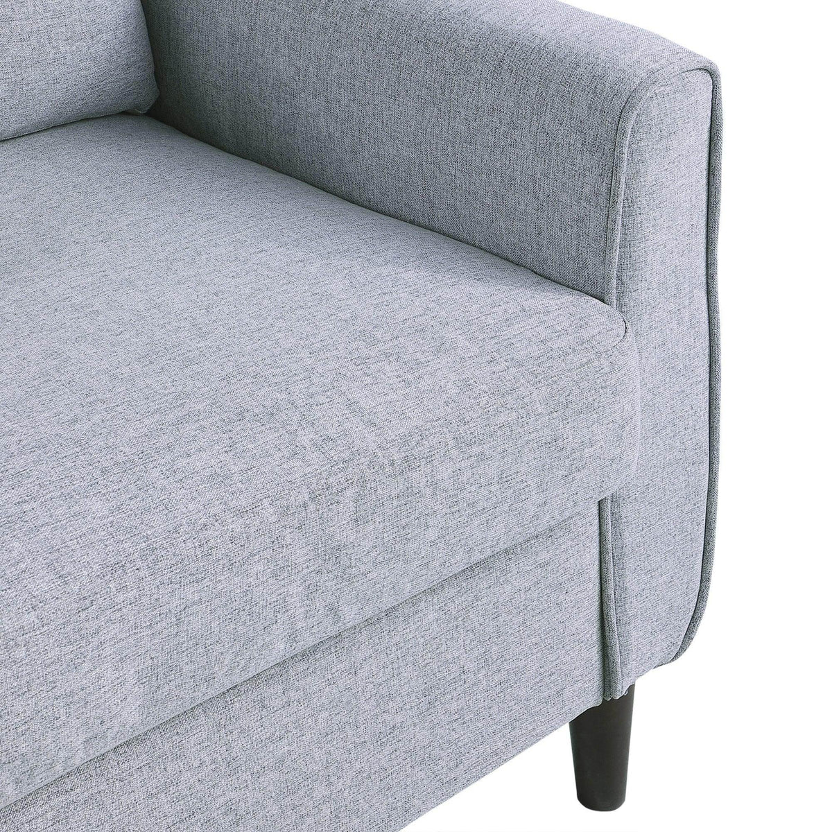 Light grey upholstered loveseat armrest and seat panel with dark wooden legs