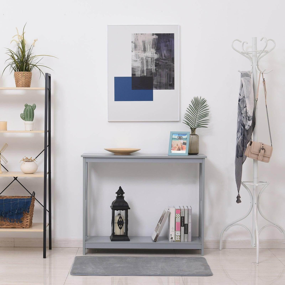 Grey console table with open storage shelf holding decor and accessories