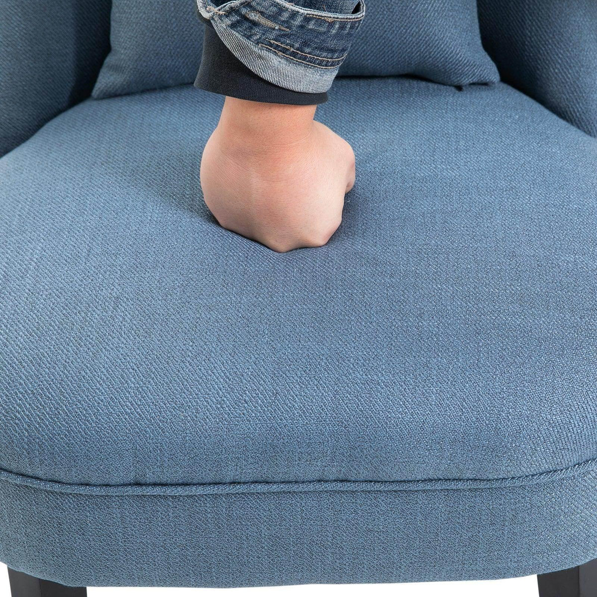 Blue upholstered armchair seat upholstery close-up with rounded front edge
