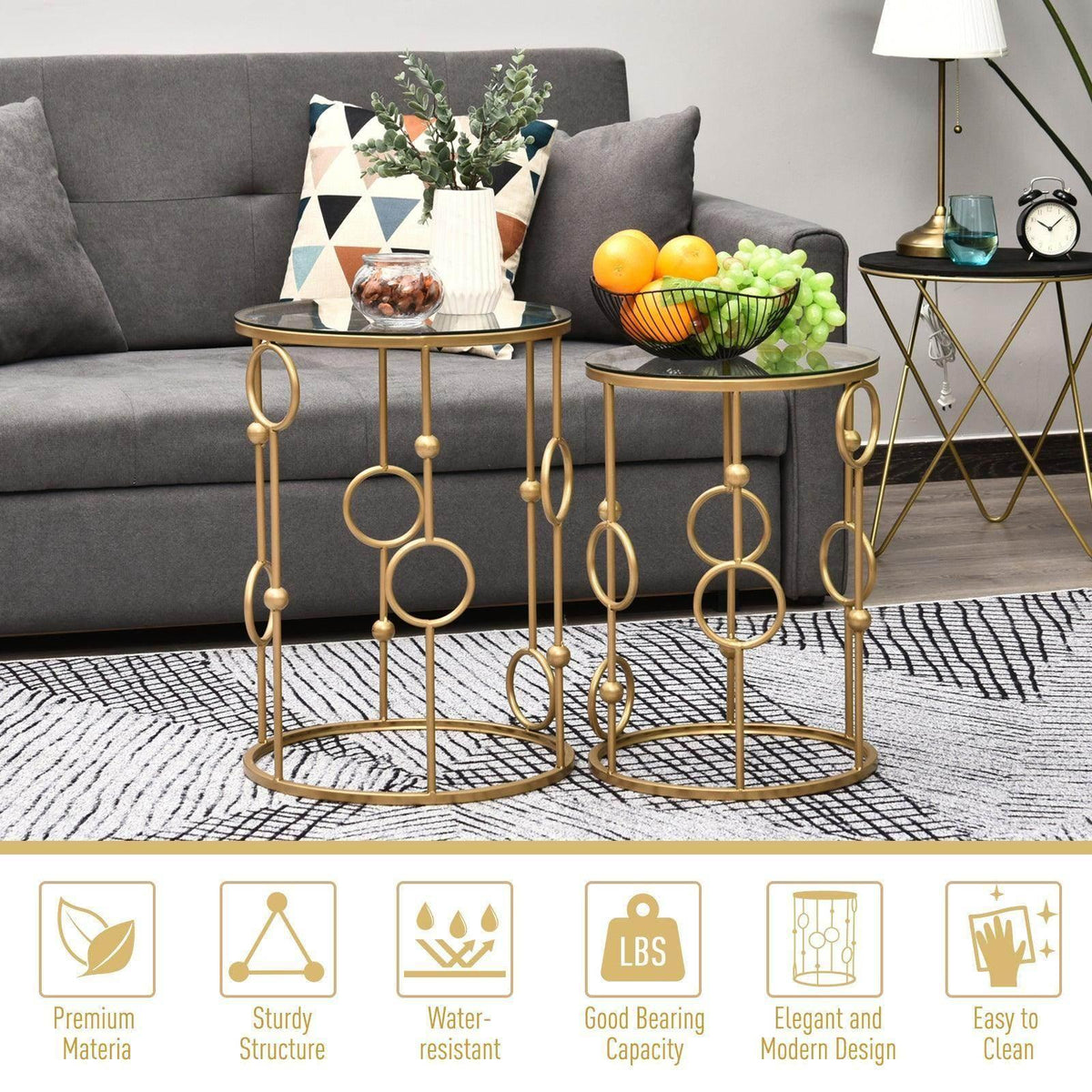 Gold round nesting coffee tables with clear glass tops and ornamental ring-shaped legs