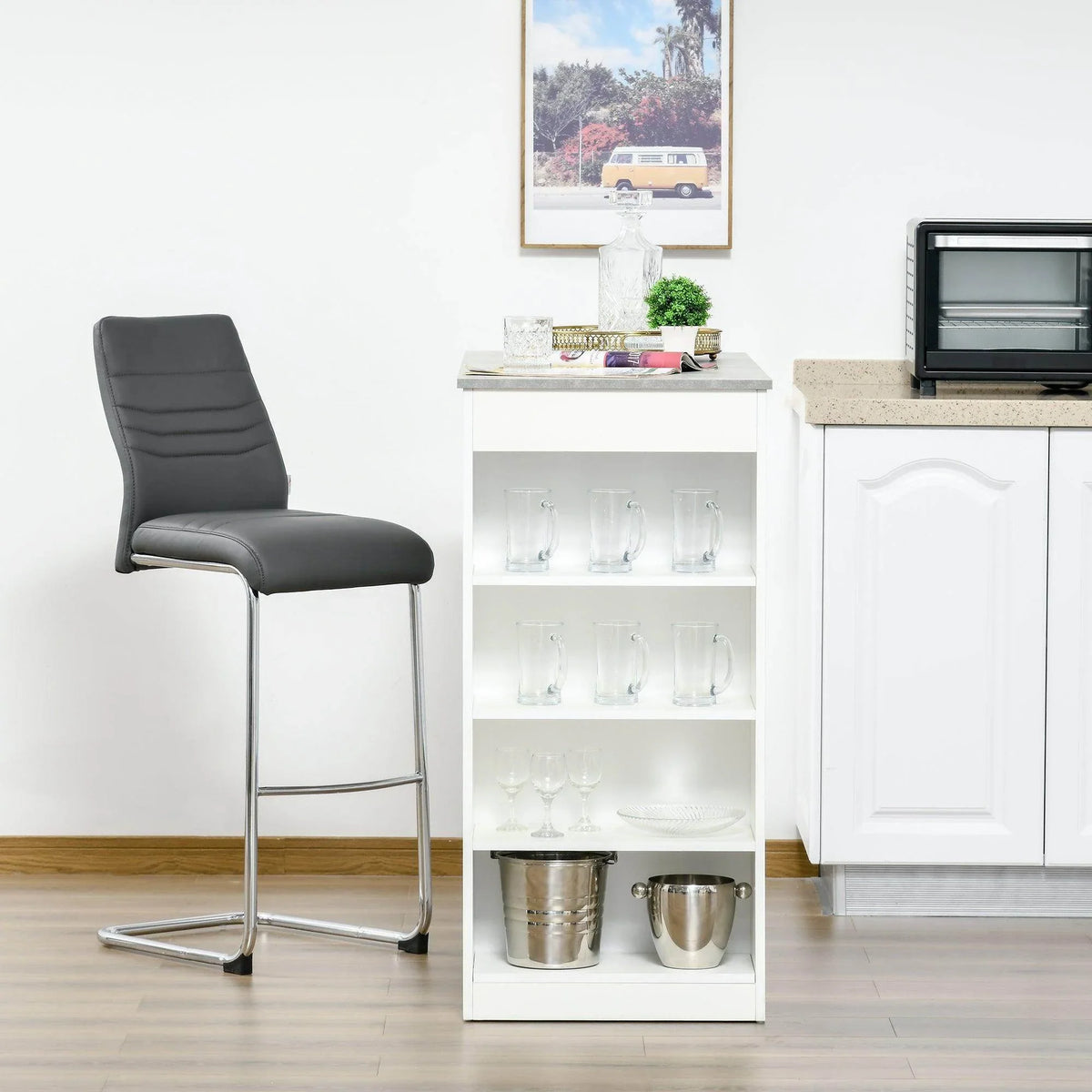 White bar table with grey top and open 4-tier shelf holding cups and pitchers.