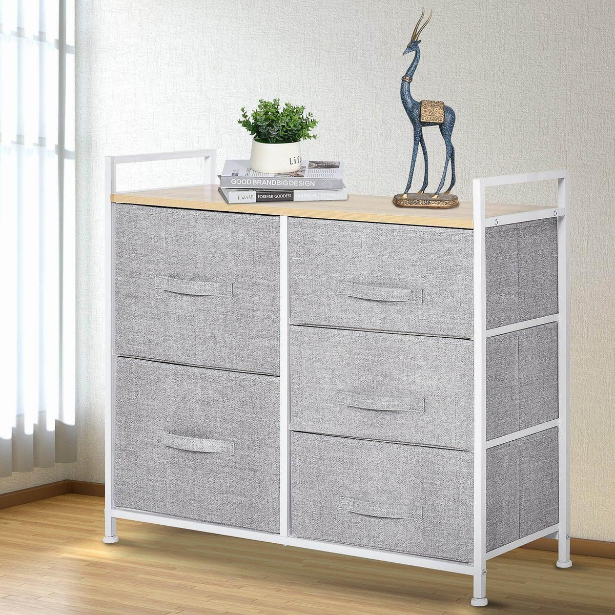 Grey fabric storage unit with 5 drawers, white frame, and light wood top shelf