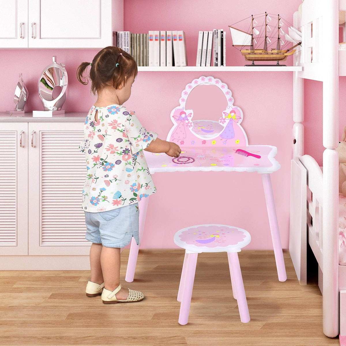 Kids pink dressing table set with oval mirror and matching stool, floral artwork.