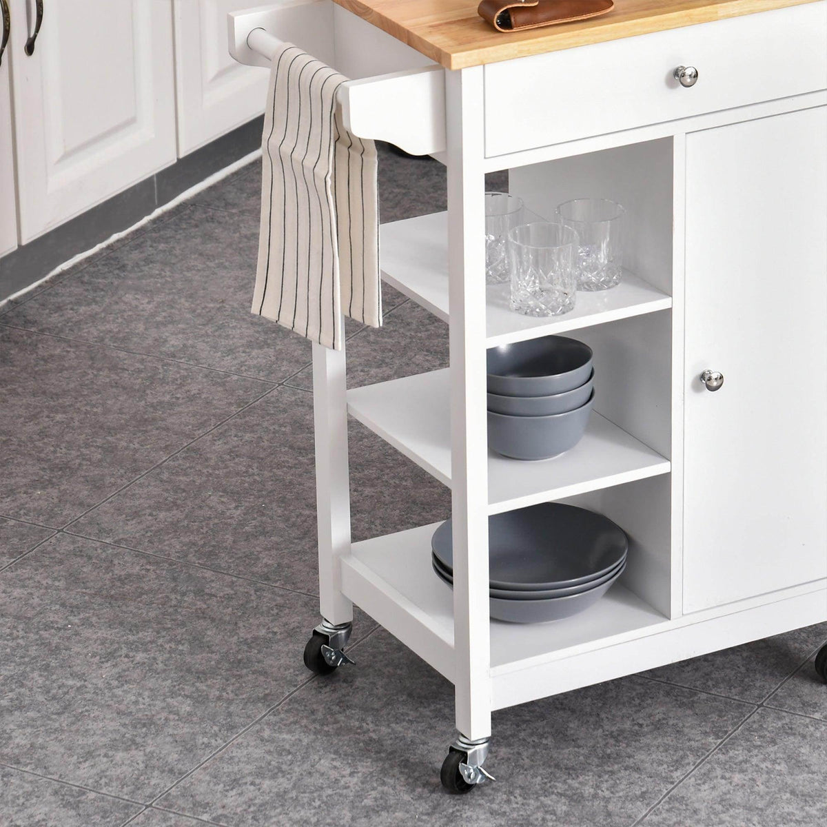 White kitchen trolley side view with open shelves for dishes and towel rail on casters