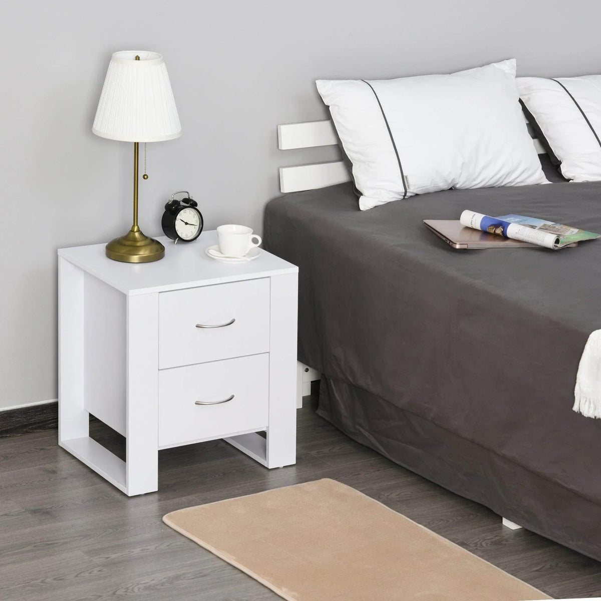 White 2-drawer bedside table with curved metal handles, open top surface