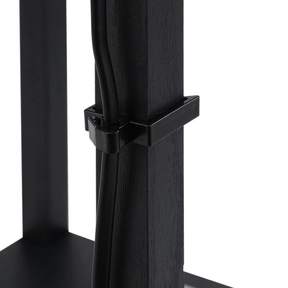 Close-up of dark base and support bars on square-frame floor lamp