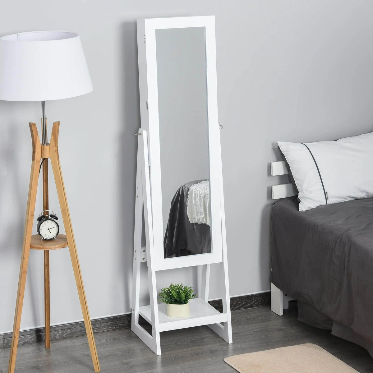 White freestanding jewelry storage armoire with full-length mirror and open interior