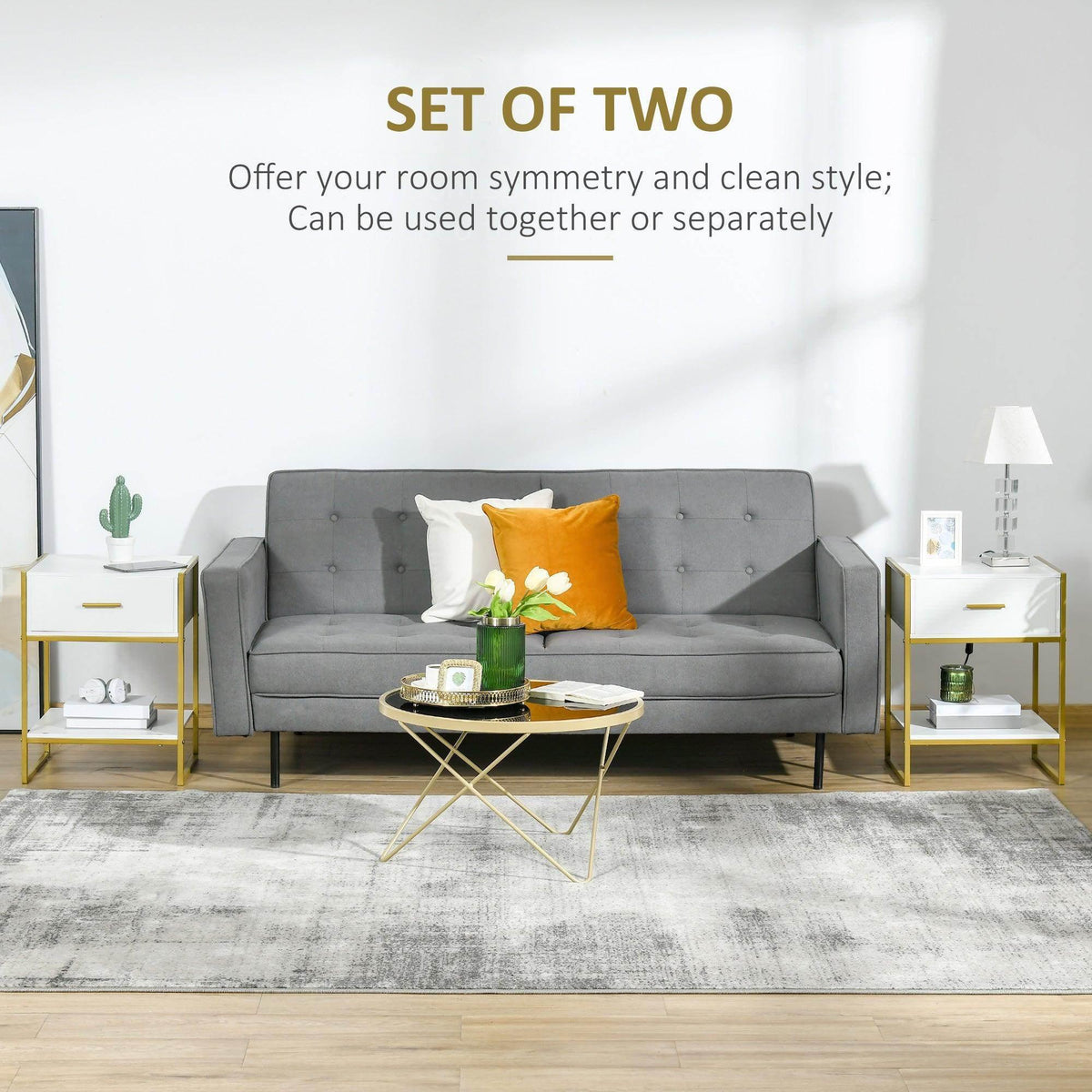 Pair of white side tables with drawer and open shelf, gold frames beside living room sofa