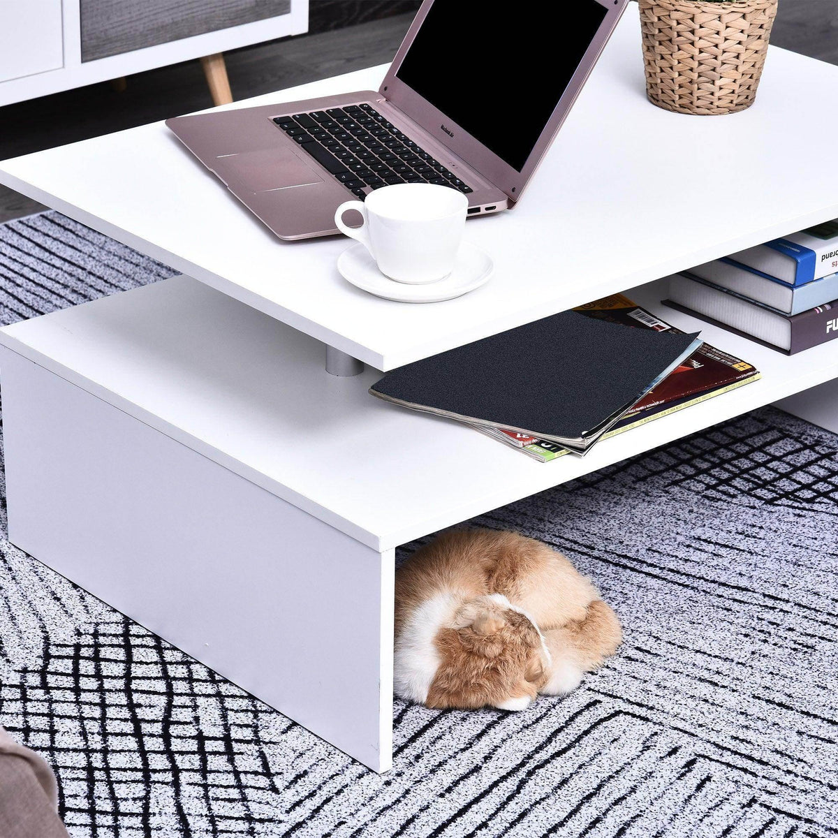 White 2-tier coffee table with open shelf, laptop and cup on the tabletop