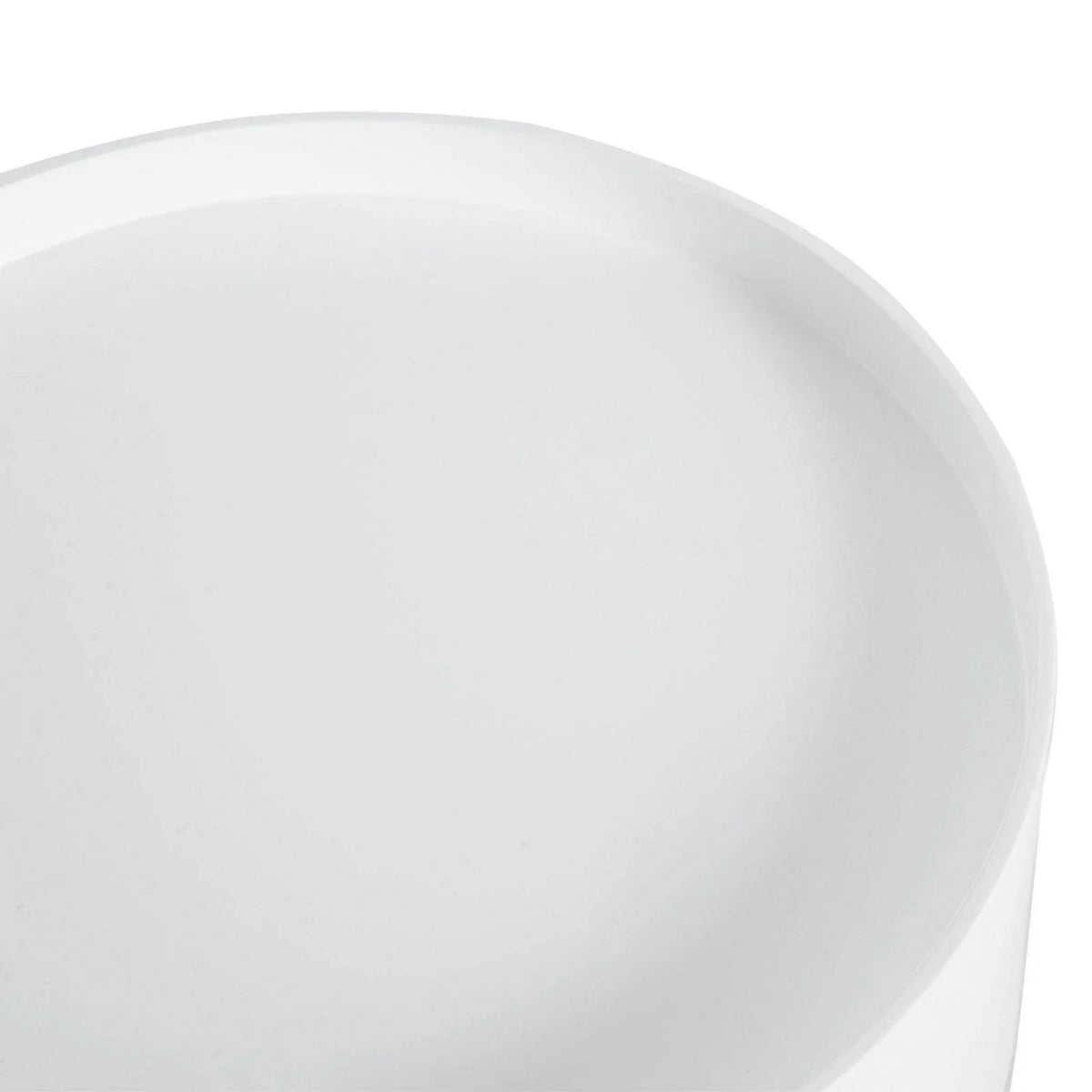 Close-up of white painted round tabletop surface on light wood legs