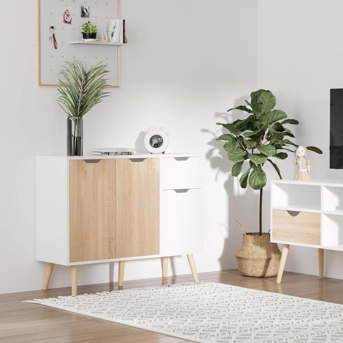 Natural wood and white sideboard cabinet with two cabinet doors and tapered legs.