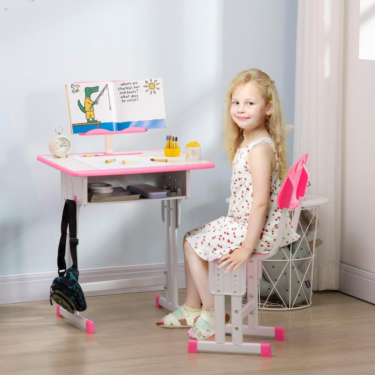 Kids desk set with pink tabletop, white frame, and matching pink chair