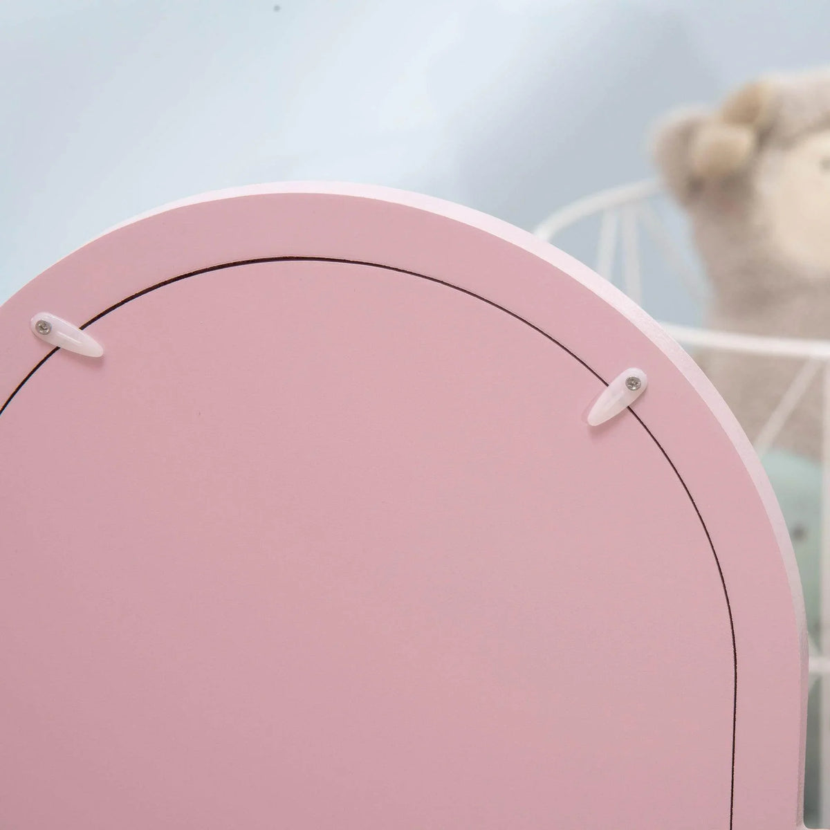 Pink heart-shaped vanity mirror with arched top and two metal knobs