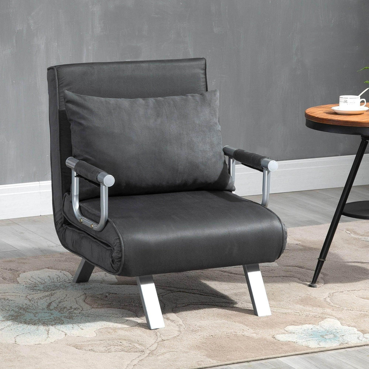 Portable armchair bed, dark gray padded seat with fold-out back, white metal legs