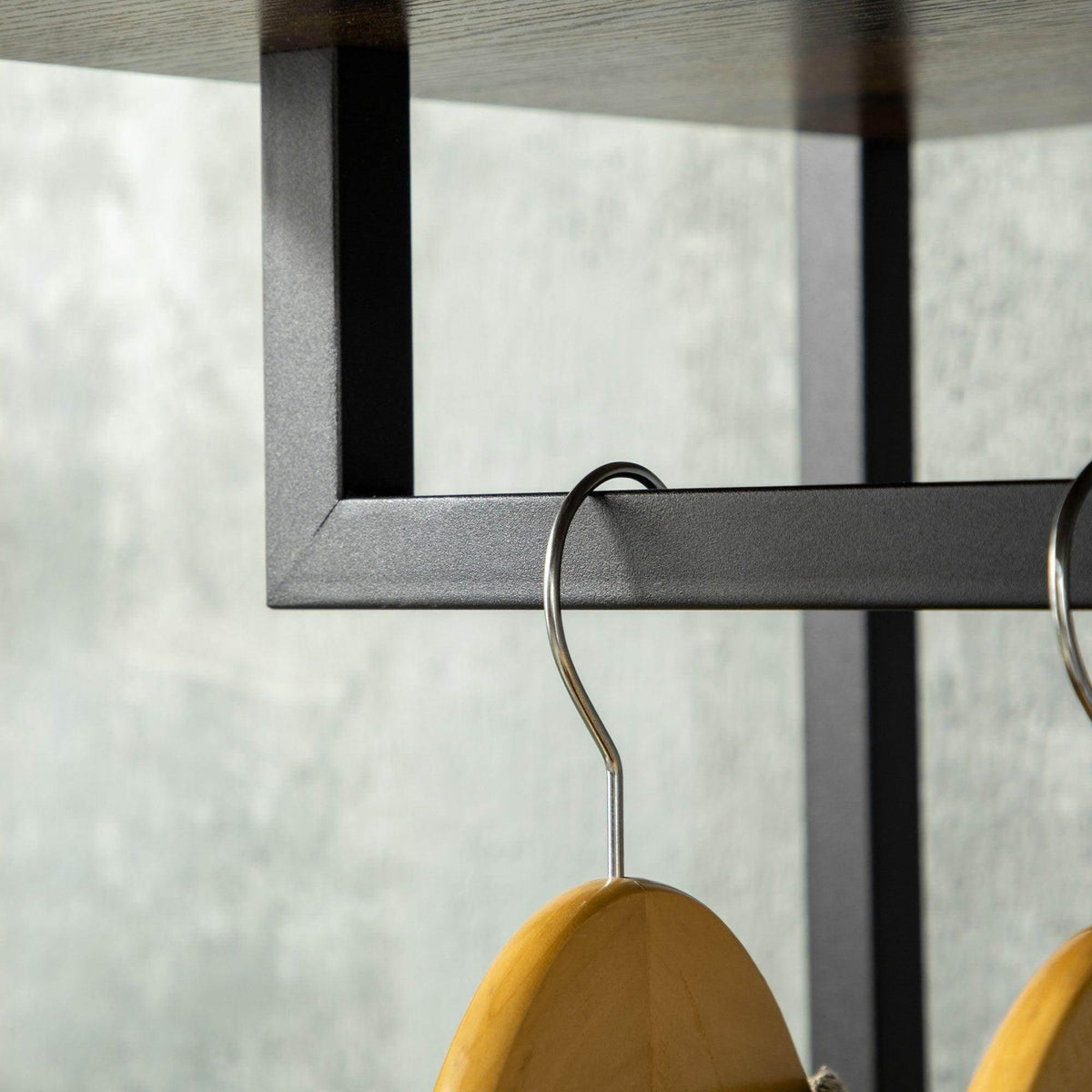 Coat stand hanging rail with wooden hanger and curved metal hook