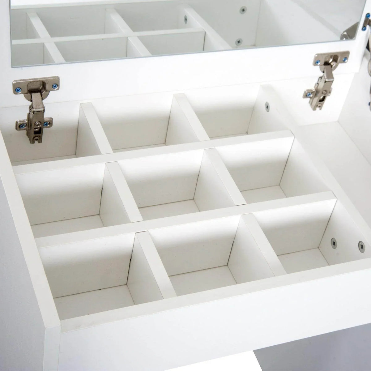 White vanity cabinet interior with multiple storage compartments