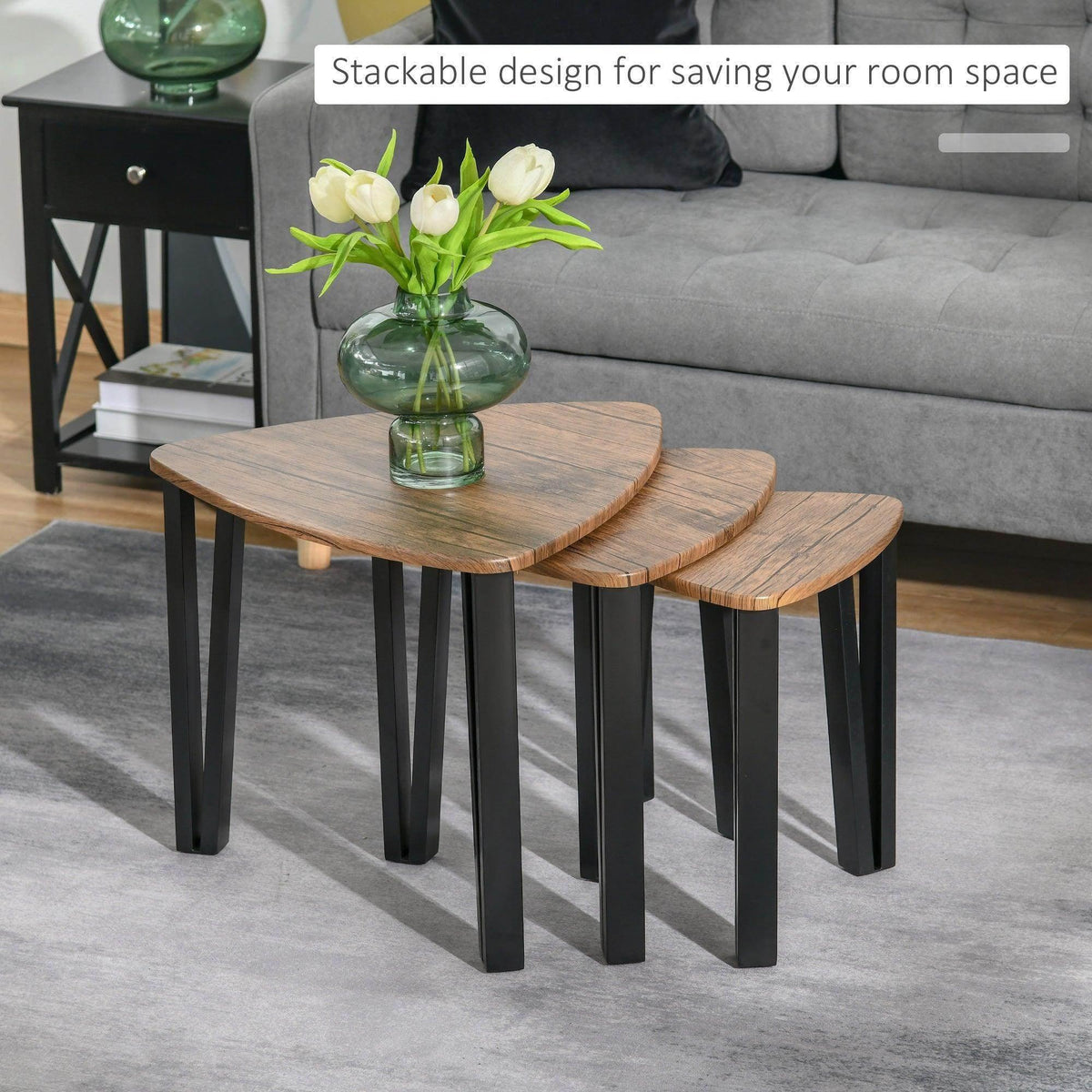 Walnut-tone coffee tables, stackable nesting design with rounded tops and black legs
