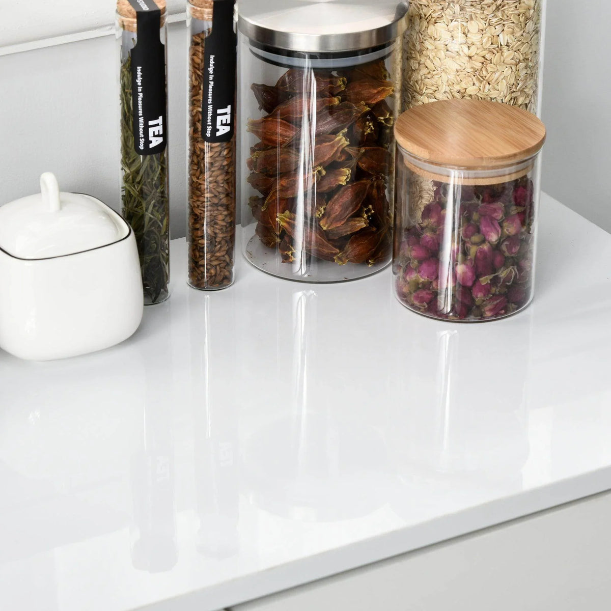 White glossy cabinet top board for organizing jars and containers