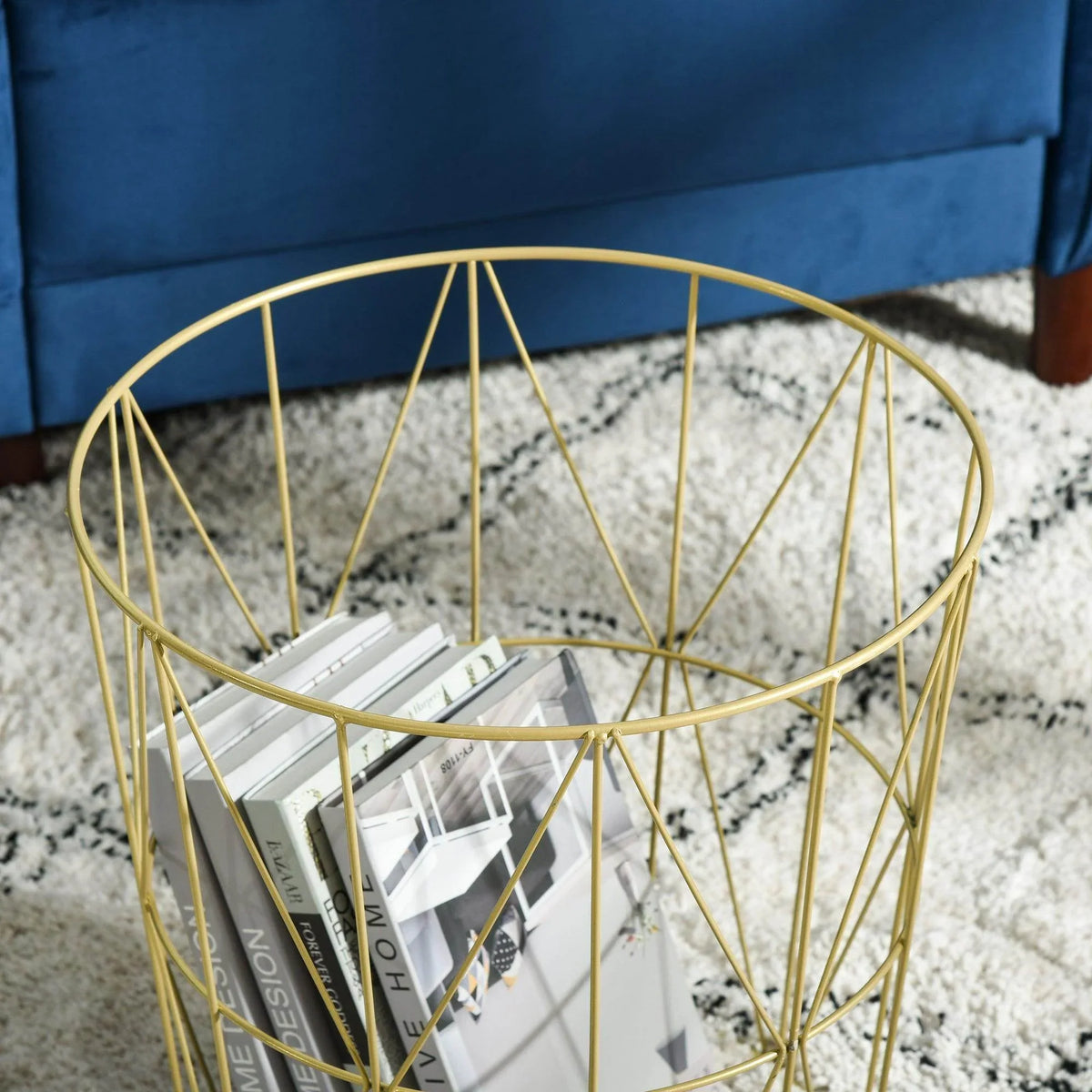 Close-up of gold wire-frame storage basket with round white tabletop