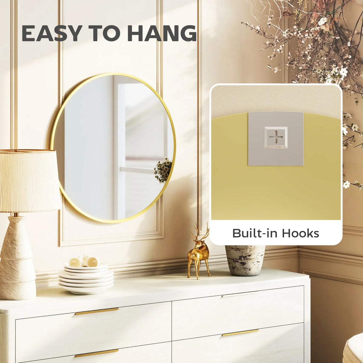 Round gold-tone wall mirror with built-in hooks for hanging