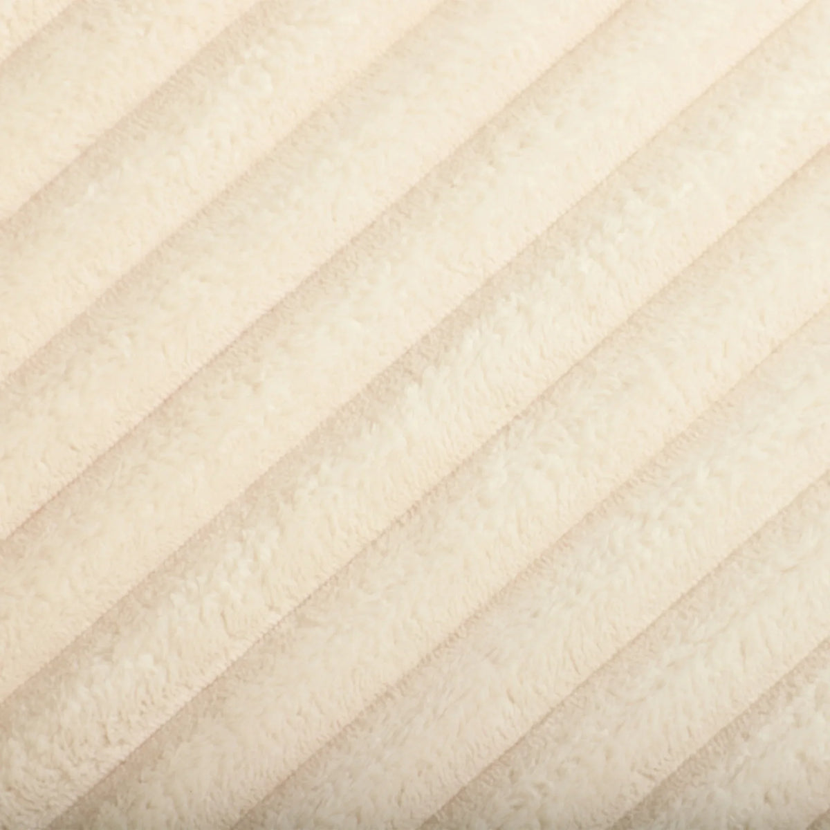 Close-up of cream corduroy fabric with ribbed vertical texture