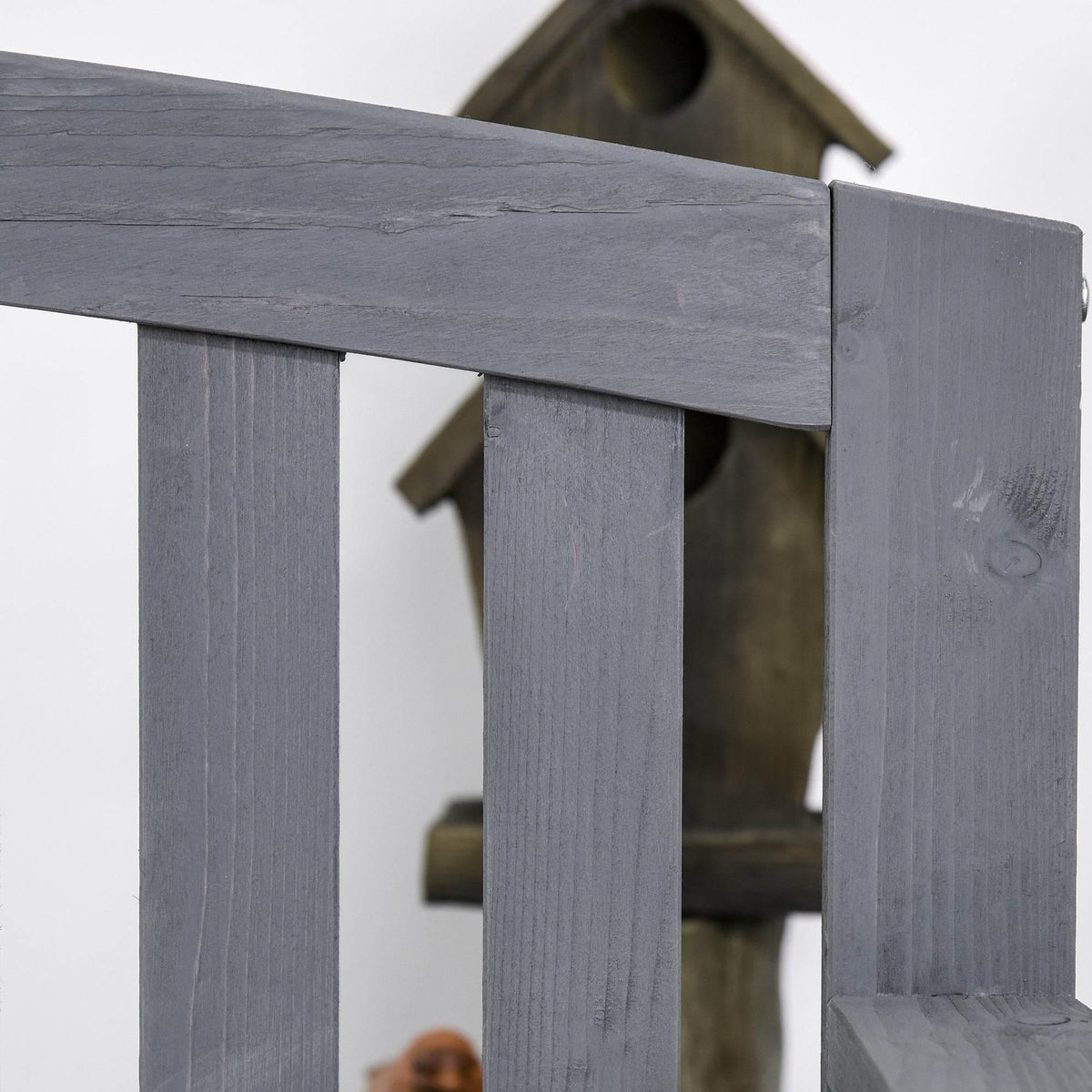 Grey fir wood bench armrest support post and slatted side detail