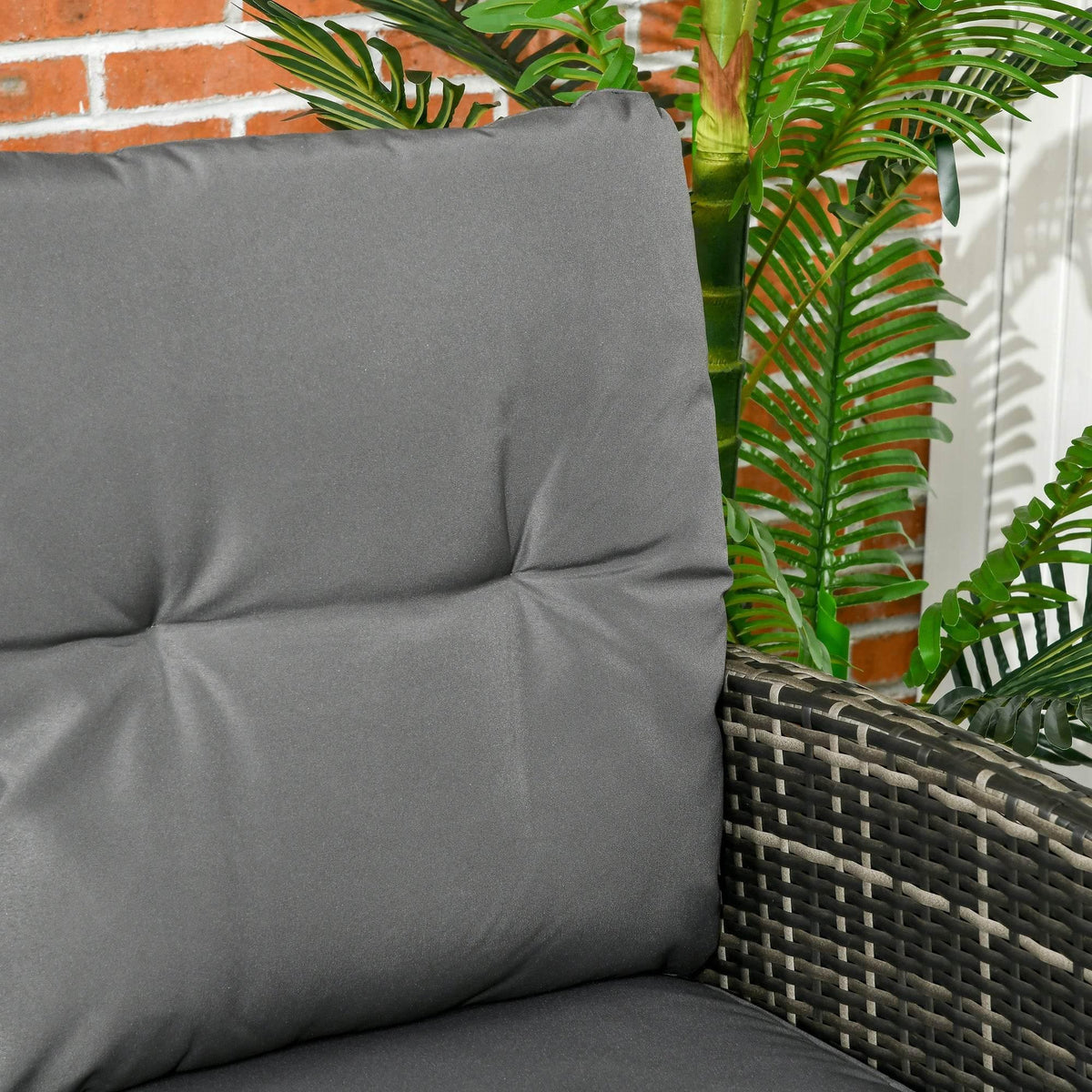 Gray cushioned armchair back with dark gray PE rattan sides