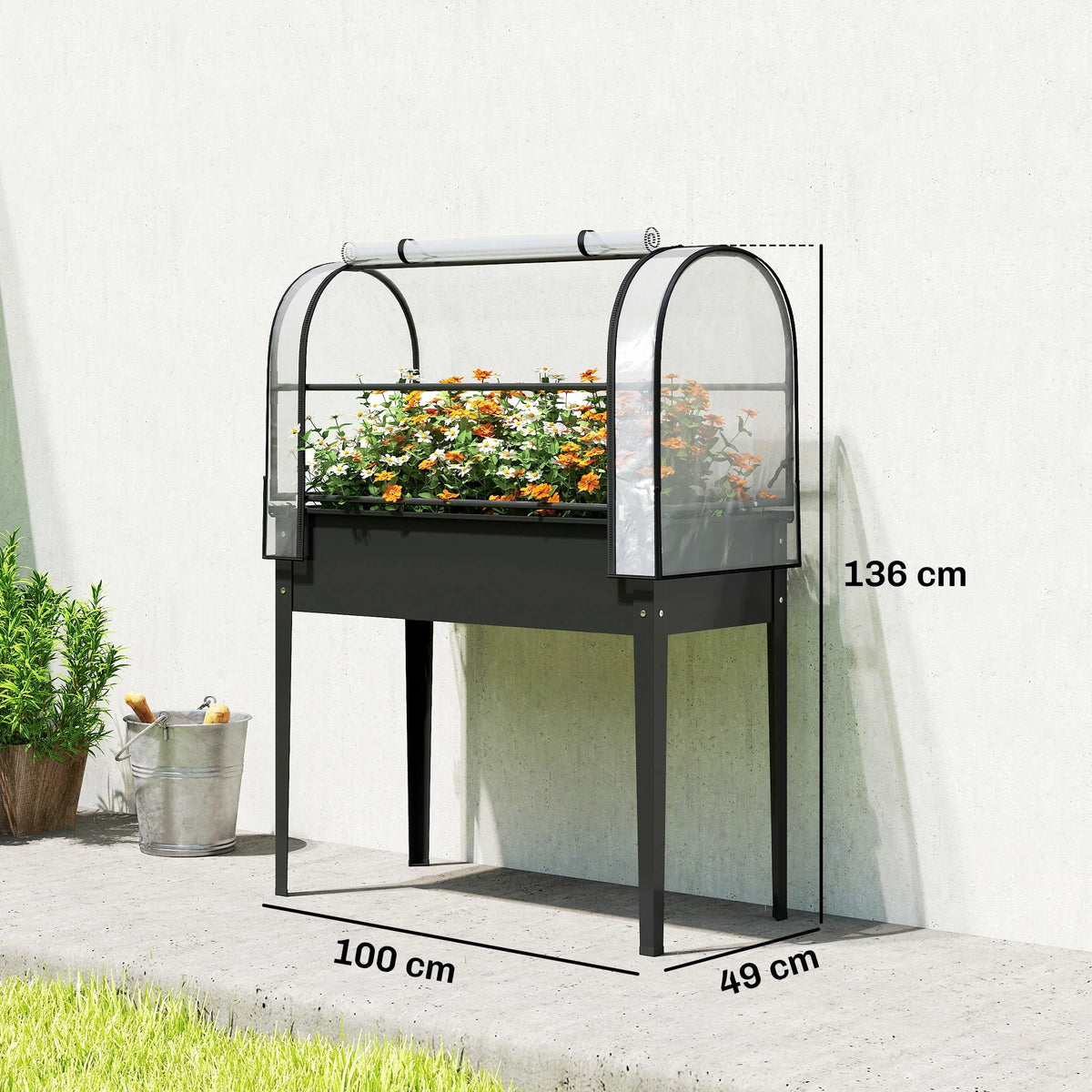Black metal raised greenhouse planter with clear cover panels and arched door frames