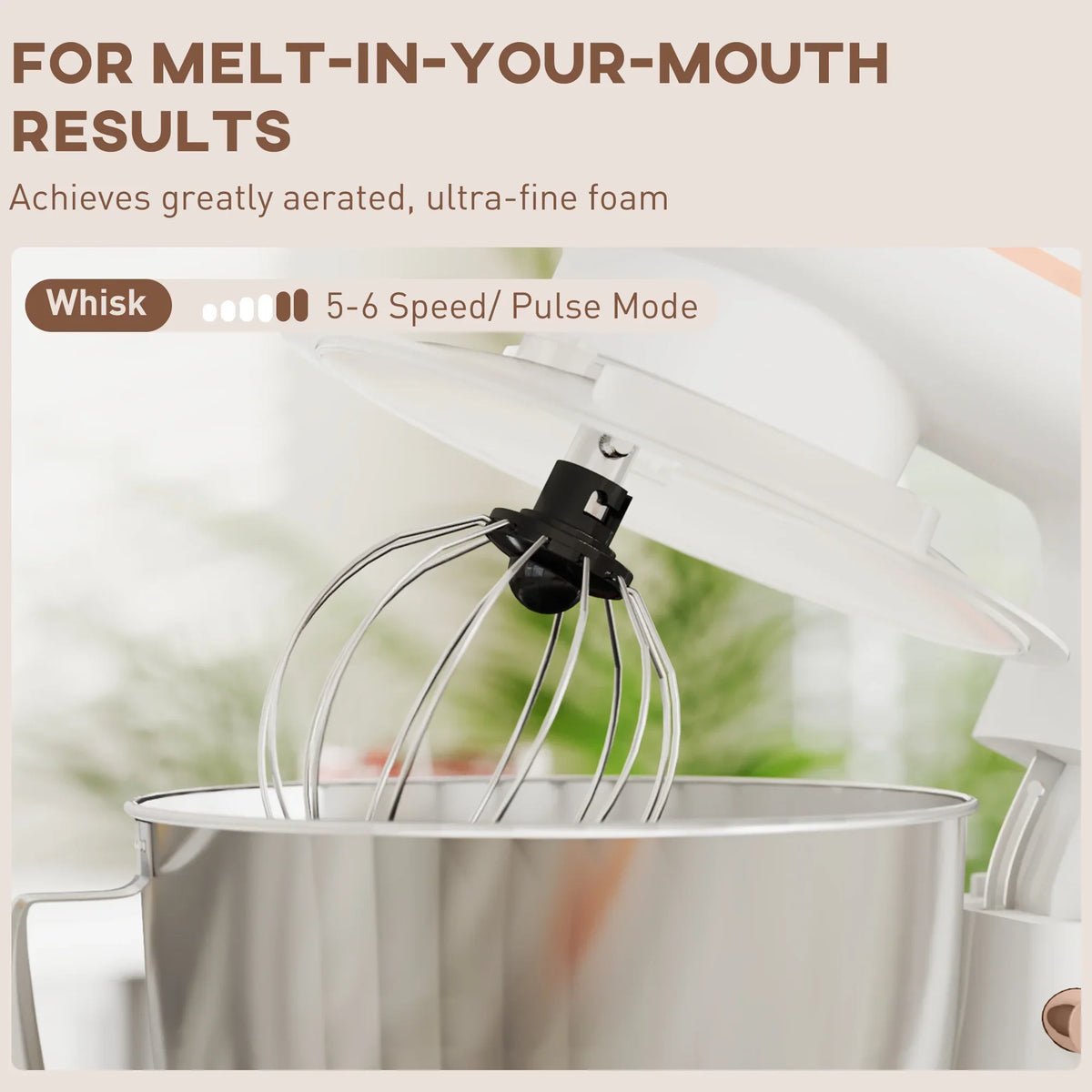 White stand mixer with stainless bowl and whisk attachment over the bowl