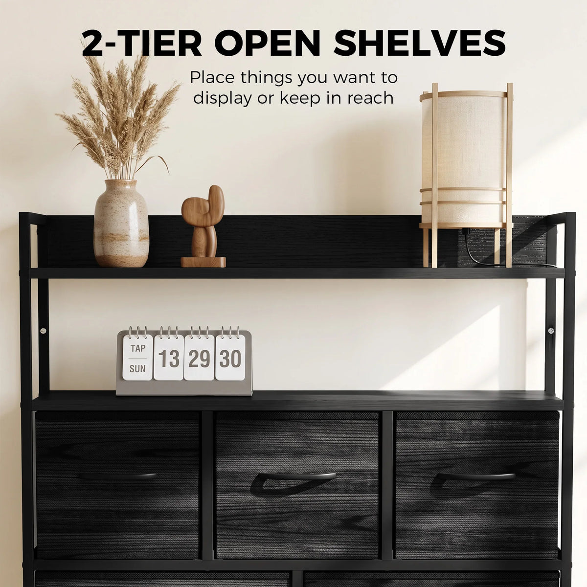 Black fabric dresser with two-tier open shelves and three drawer sections, front view