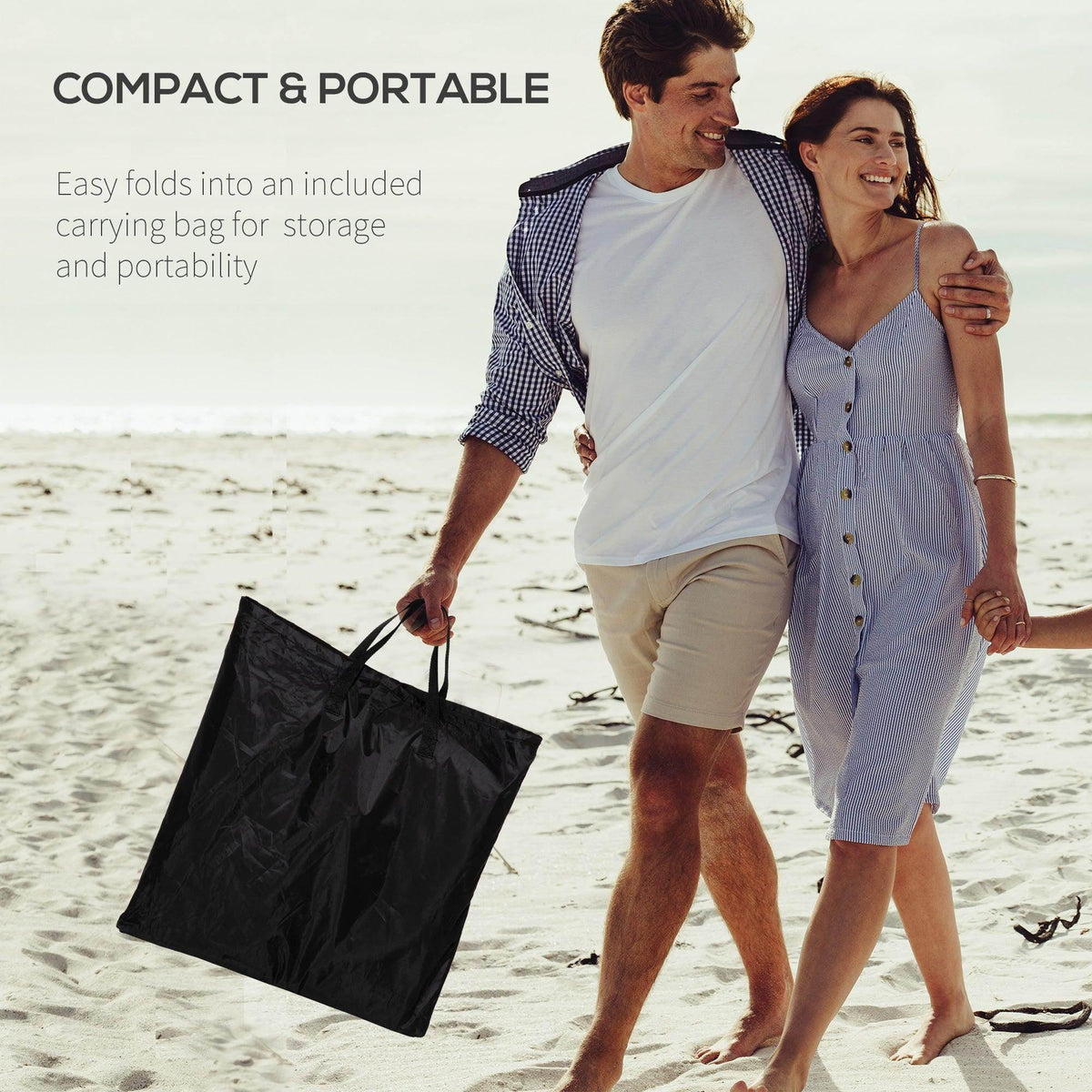 Black folding beach chair set with carrying bag, shown with pillows and padded seat