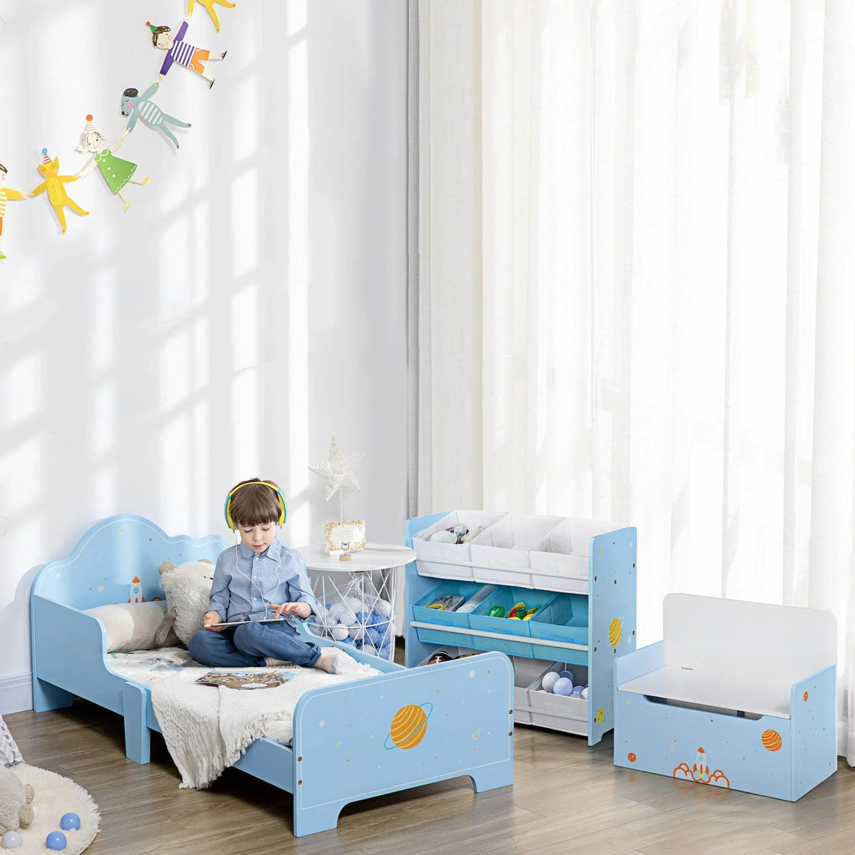 Light blue toddler bed with open under-bed storage and front guard rail