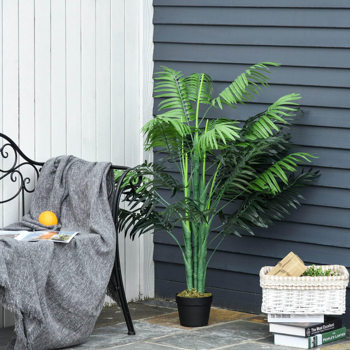 Artificial palm tree in black pot with green faux fronds for outdoor patio decor