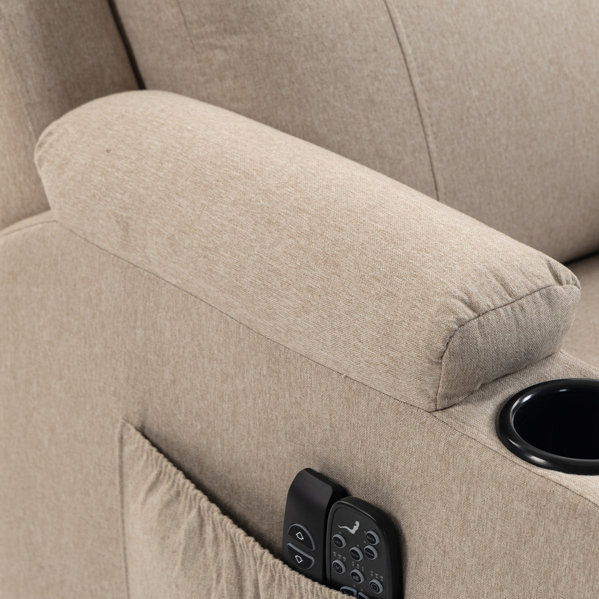 Armrest cushion close-up with side control panel on a light beige recliner