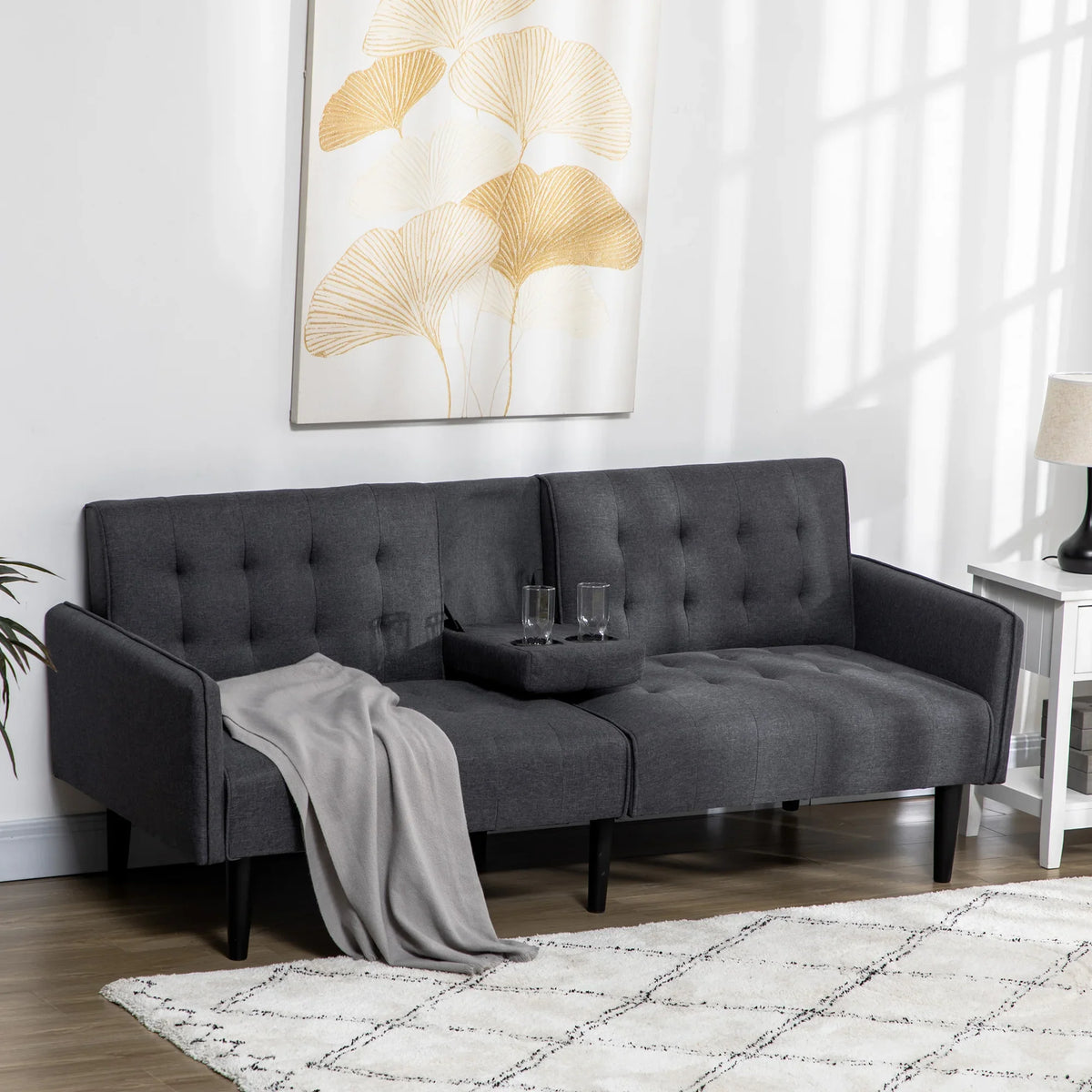 Dark grey three-seat convertible sofa bed with tufted back and curved arms