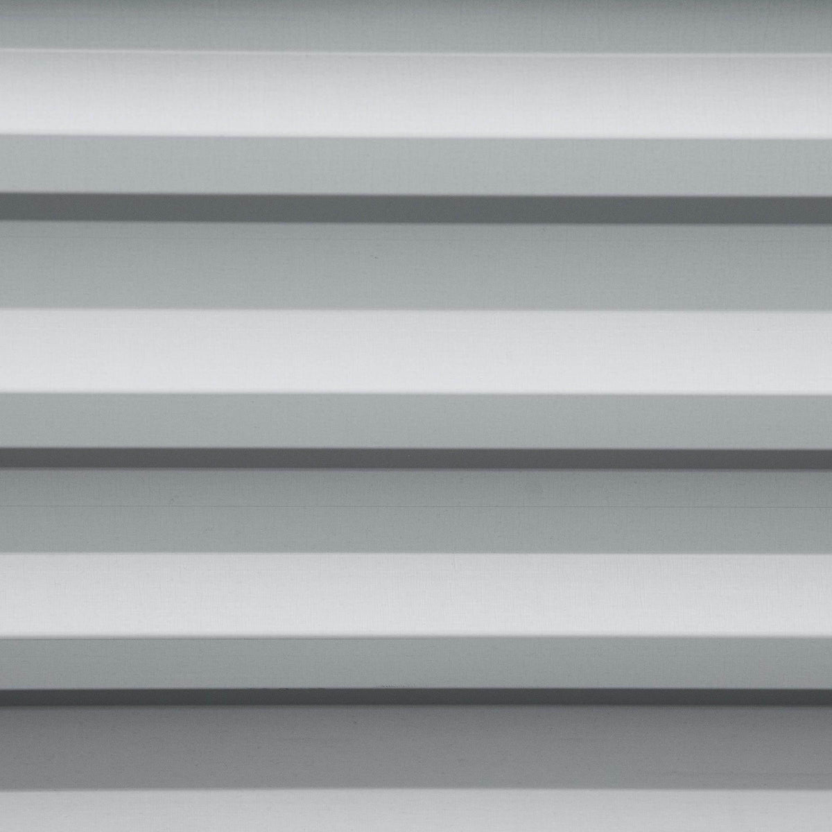 Light grey slatted metal panel from a raised garden bed planter box