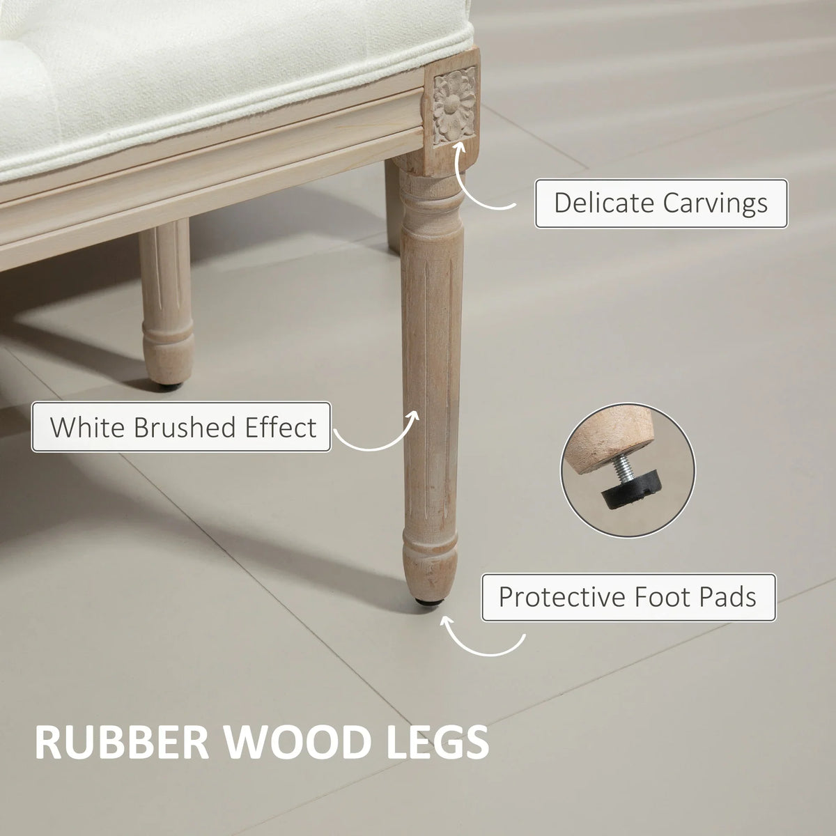 Cream upholstered bench with delicate wood carvings and protective foot pads on legs
