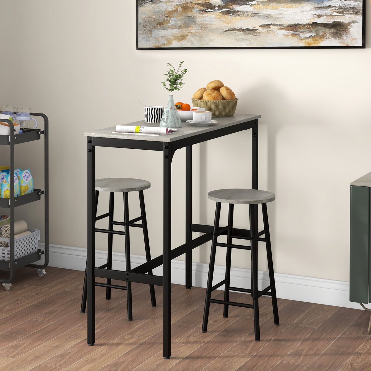 Industrial bar table set with two grey round stools and dark metal frames