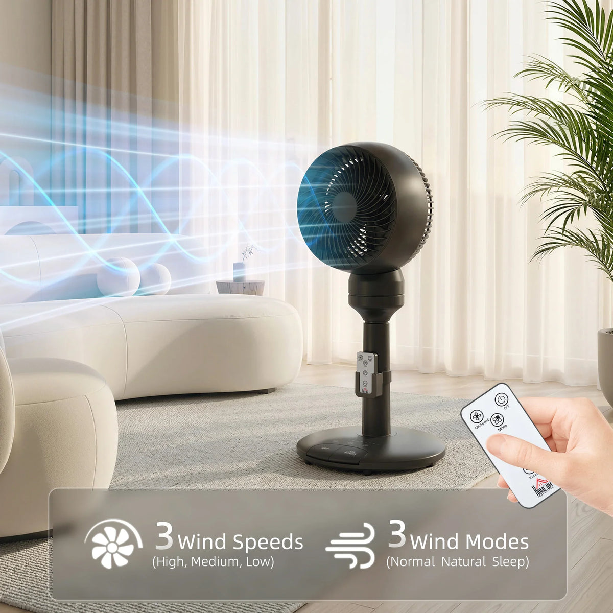 Black pedestal fan with remote control and oscillating head on stand