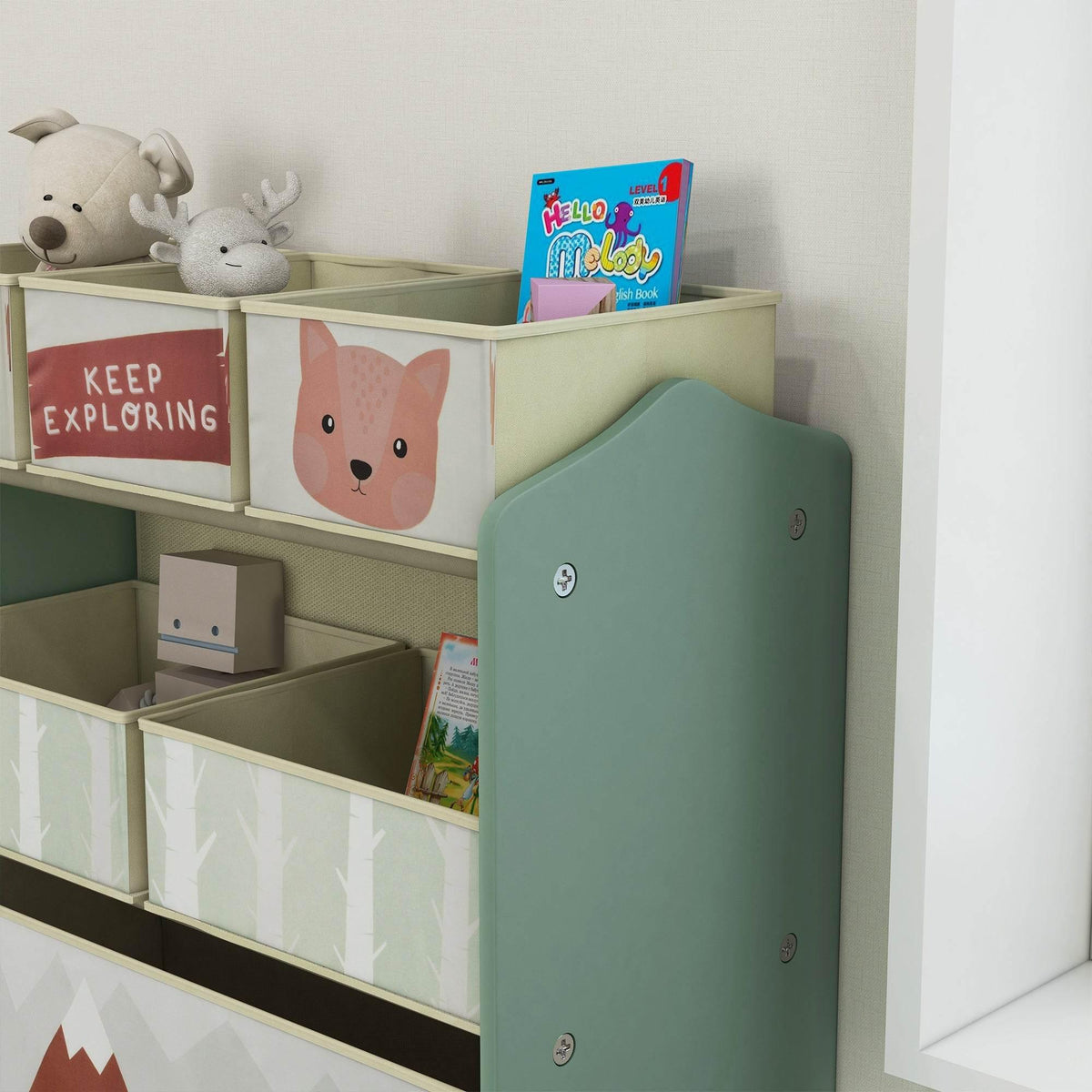 Kids green storage unit with fabric bins and bear-face bin fronts, side view