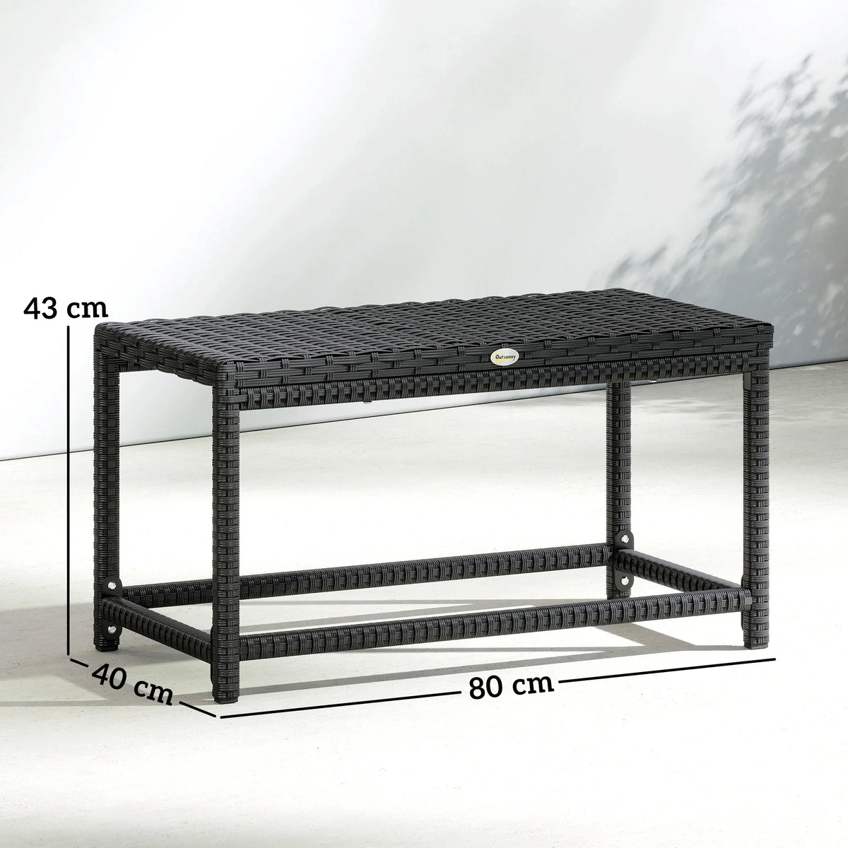 Black rectangular patio coffee table with woven top, open lower shelf, and sturdy frame.