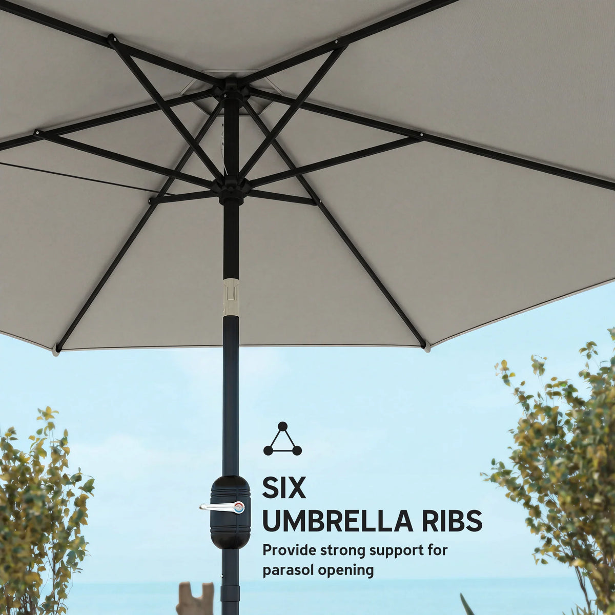 Underside of light grey parasol showing umbrella ribs supporting canopy structure