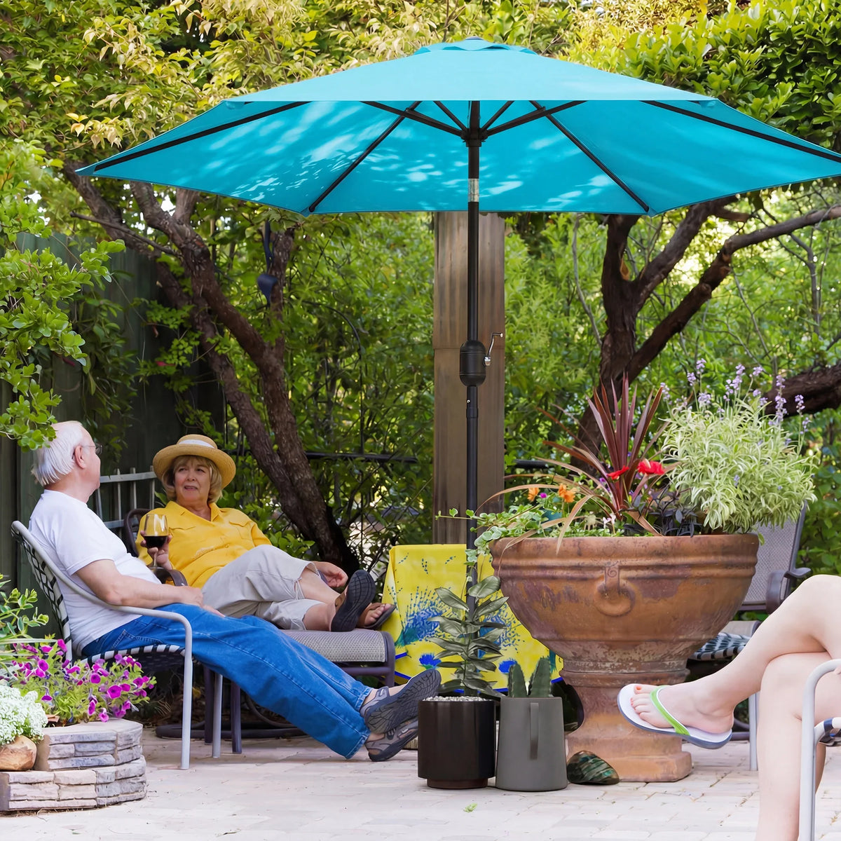 Blue patio garden parasol umbrella with metal pole and manual crank vented canopy
