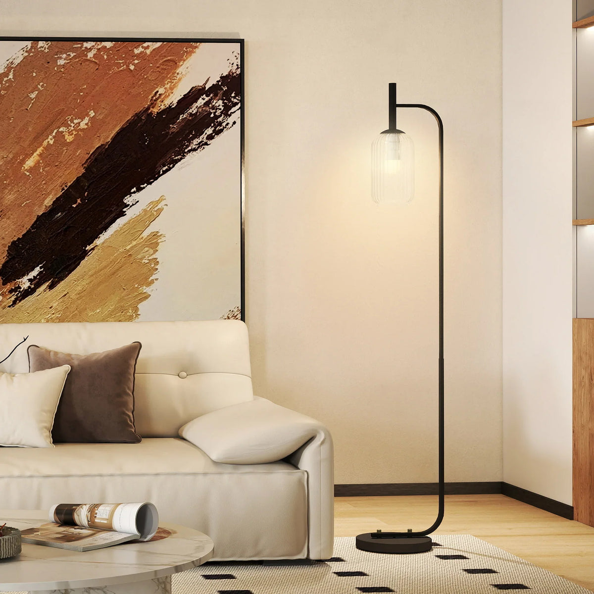 Black floor lamp with clear glass shade and foot switch base, modern standing light