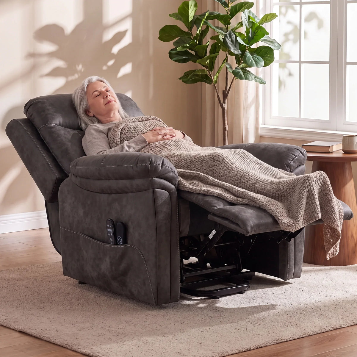 Grey electric lift recliner with extended legrest and plush padded armrest